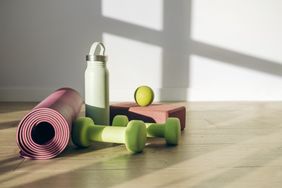 Yoga mat water bottle dumbbells and other exercise equipment