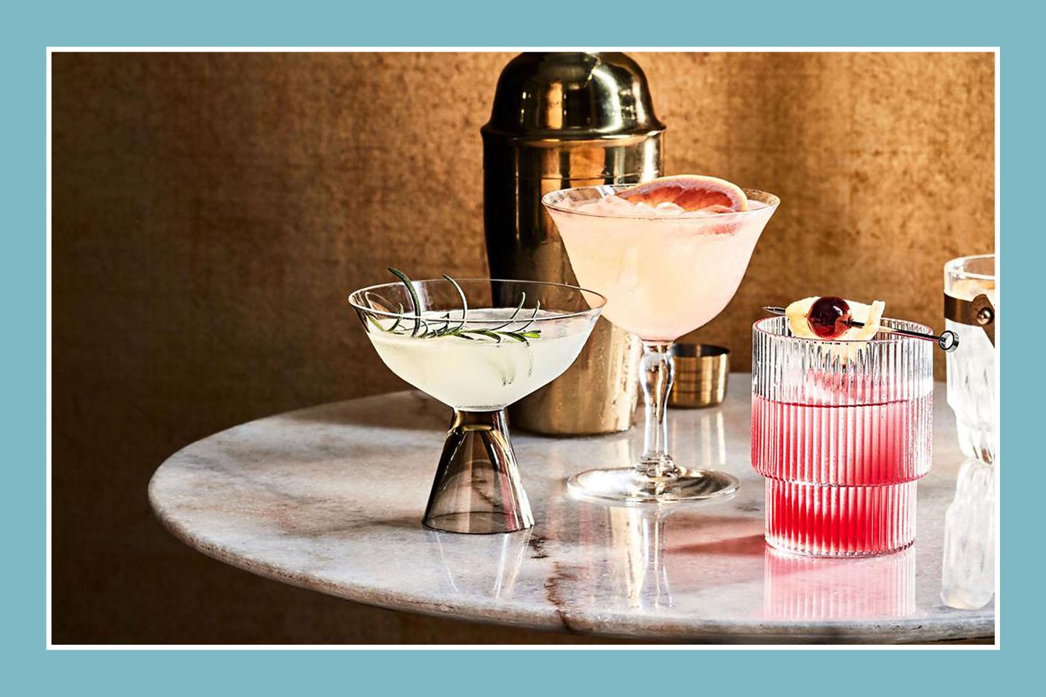 multiple cocktails on a marble surface with brown background