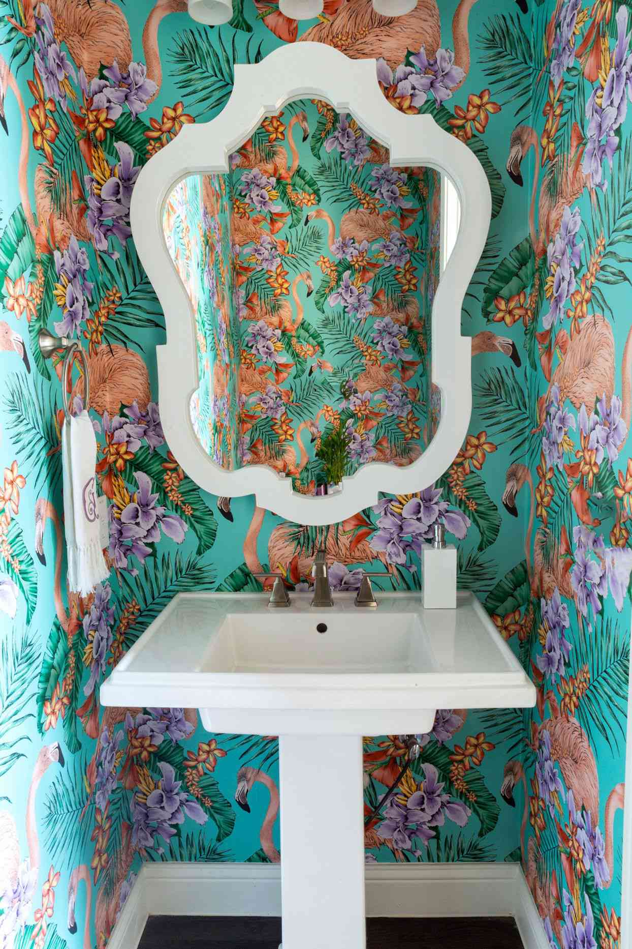 powder room with flamingo-patterned wallpaper