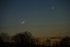 A conjunction of the planets and the moon in a twilight winter sky
