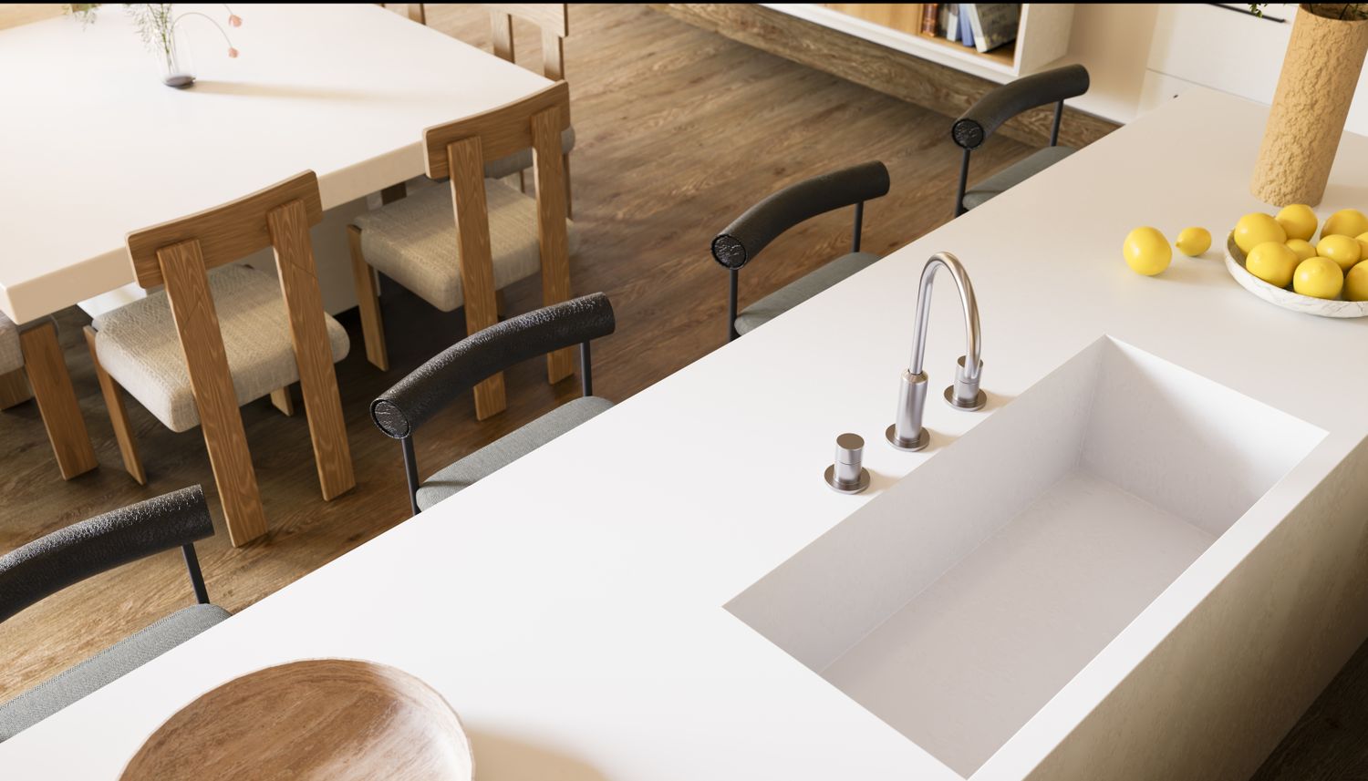Modern kitchen countertop with a sink dining area in the background