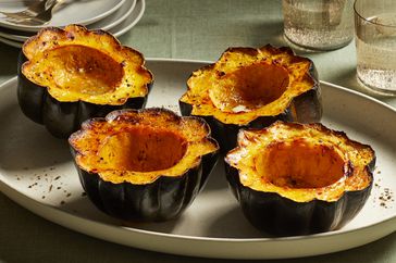 cooked acorn squash on a platter