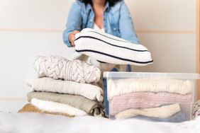winter clothing and sweater storage in clear plastic bins