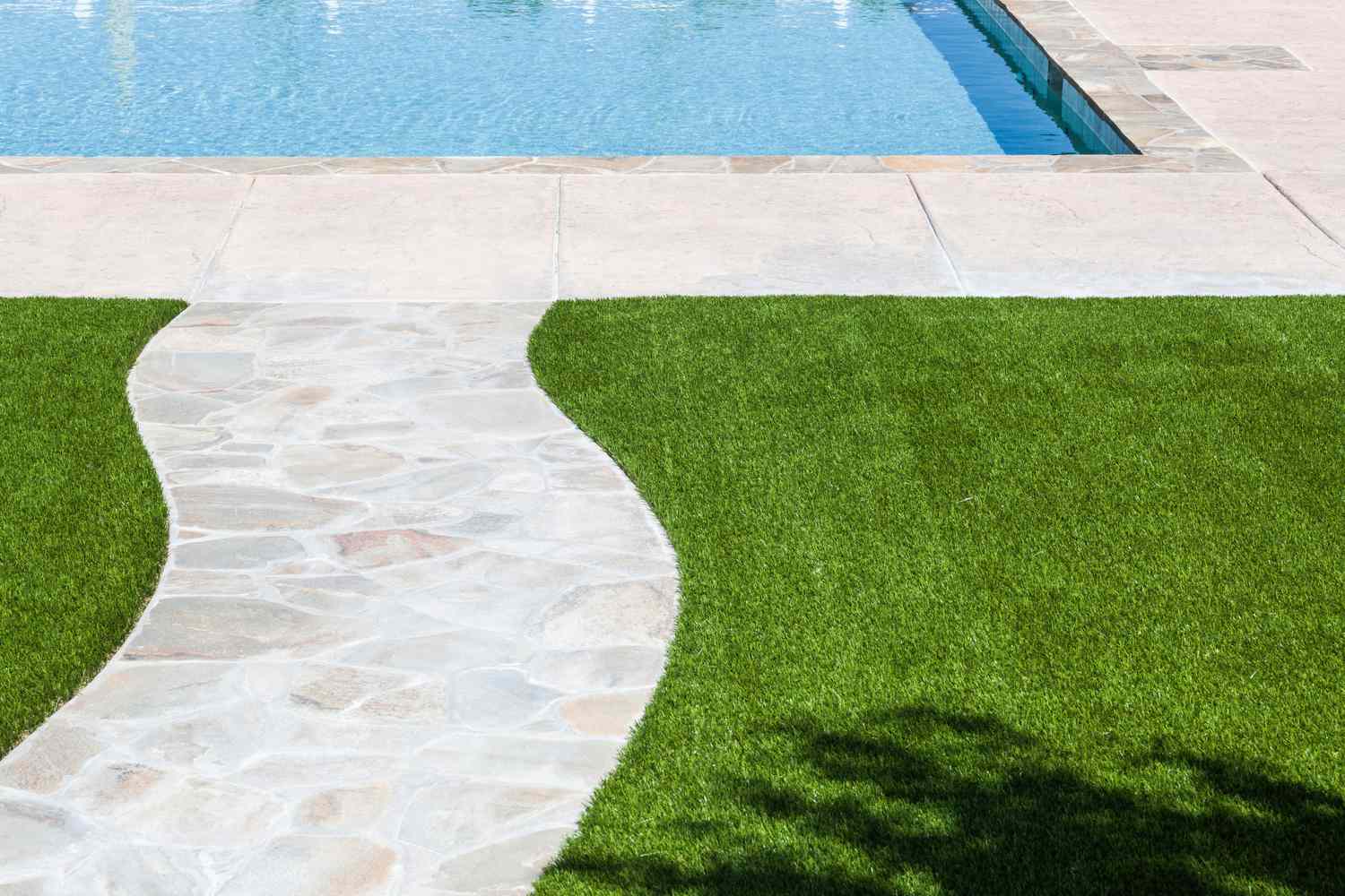classic turf lawn next to pool