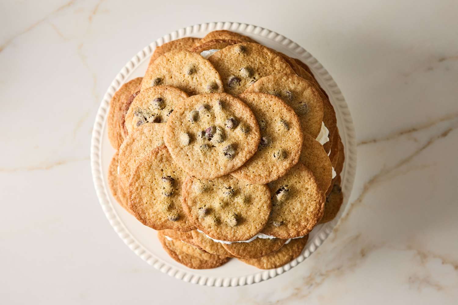 A layered chocolate chip cookie icebox cake viewed from above