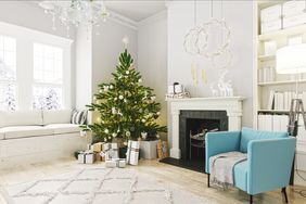 festive living room with a christmas tree and gifts