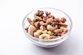 A bowl containing a variety of mixed nuts