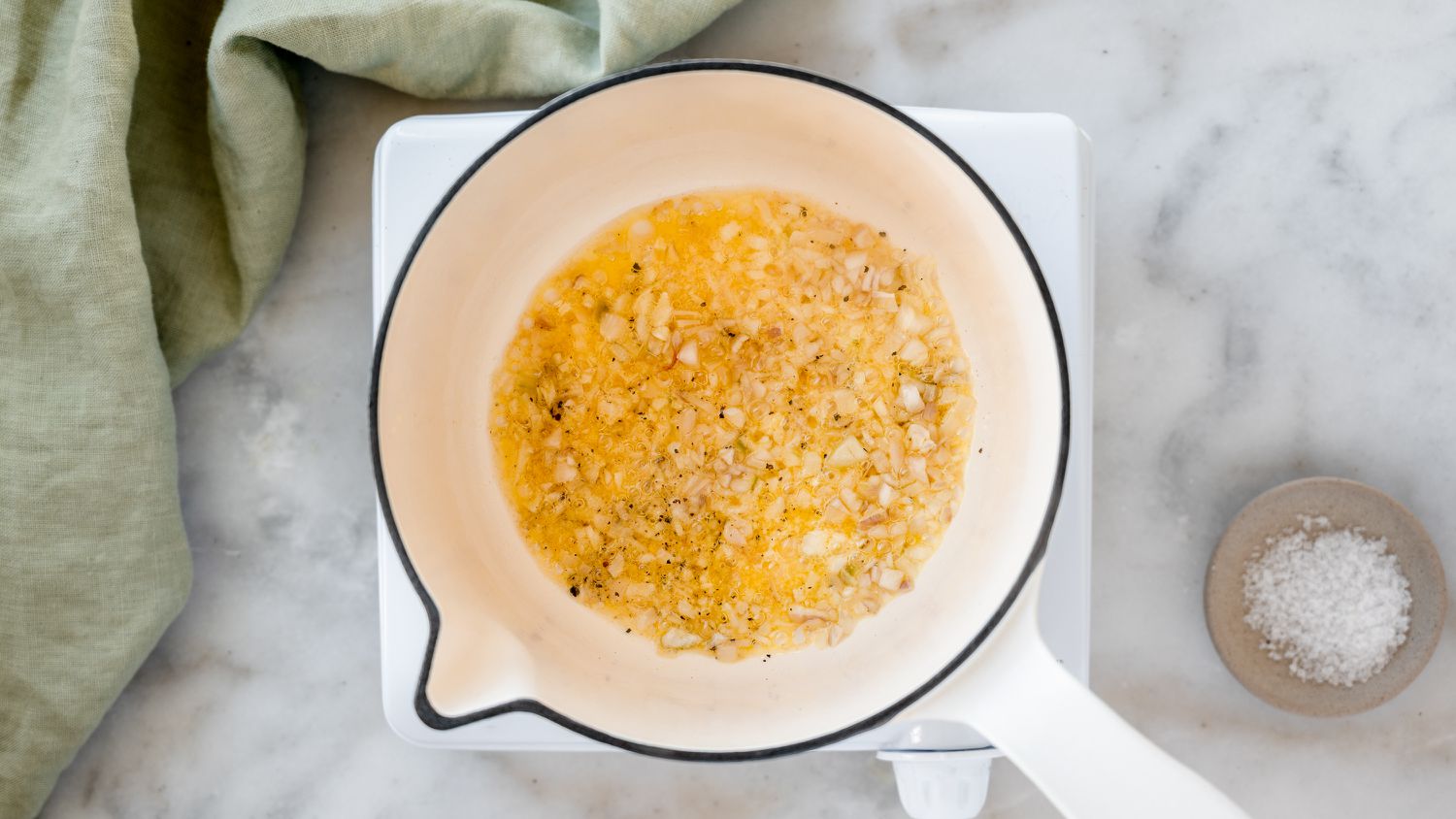 shallots cooking in a pan