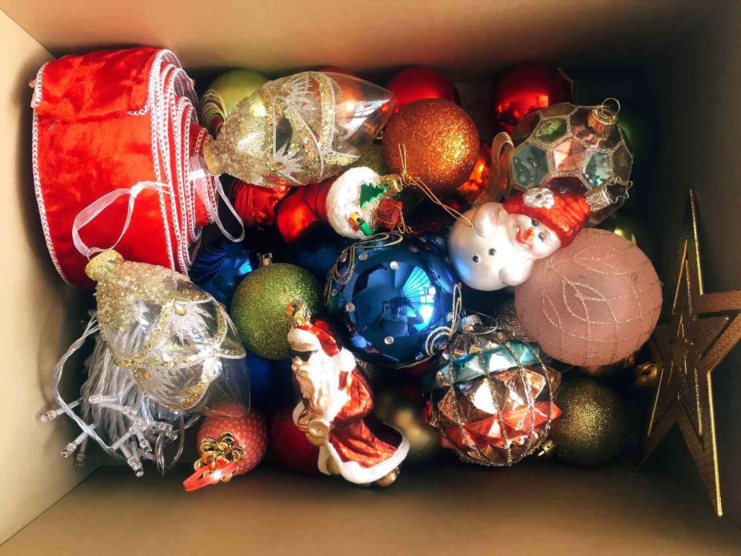 christmas ornaments in cardboard box