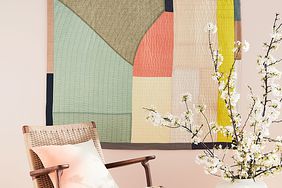 oversized quilt framed on wall