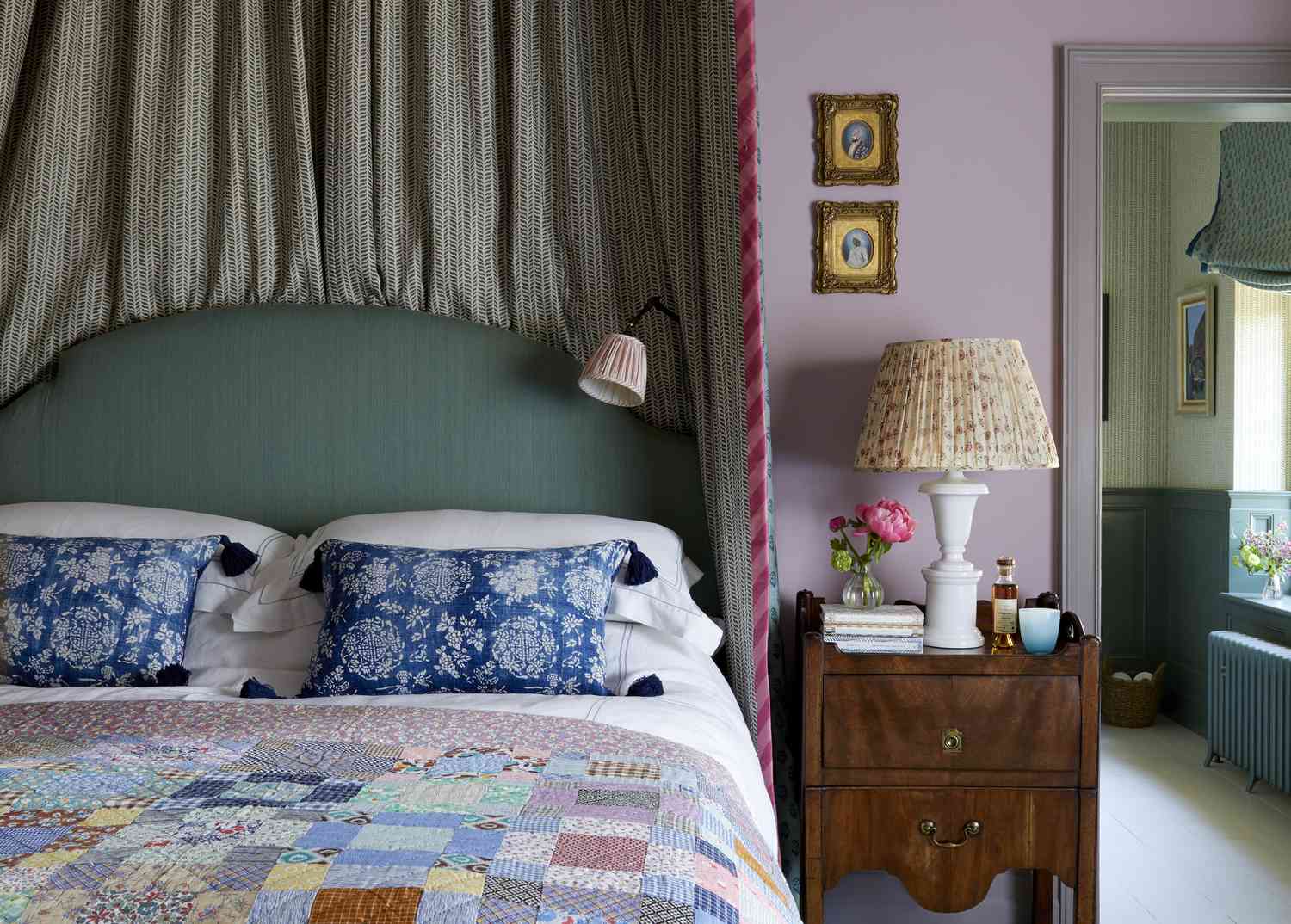 bedroom with purple walls and vintage lighting