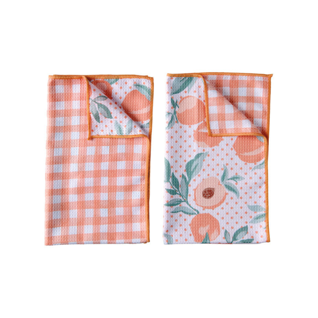 Two folded fabric pieces one with a checker pattern and the other with a floral and fruit design