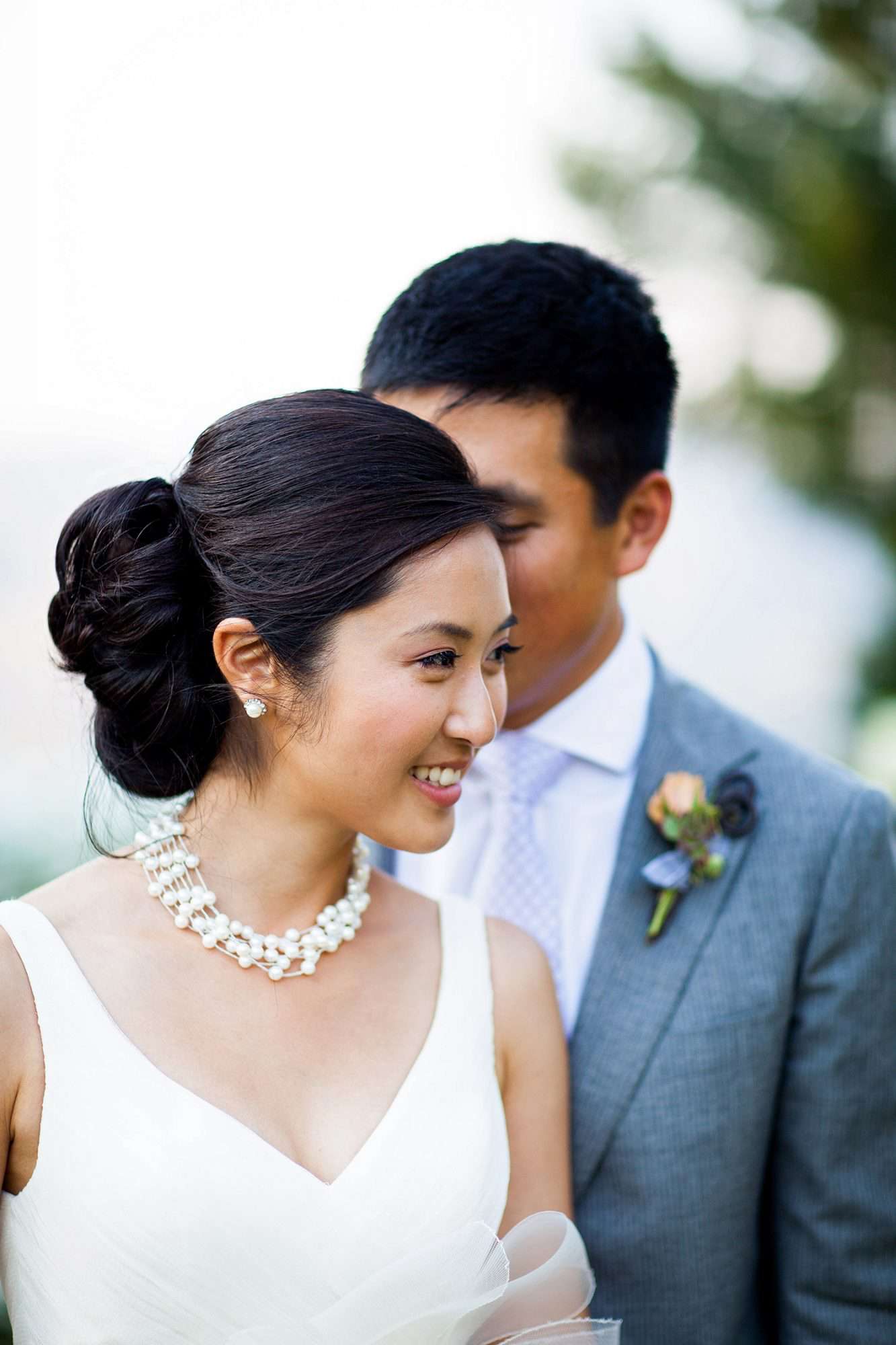 bride with v-neck dress and side bun