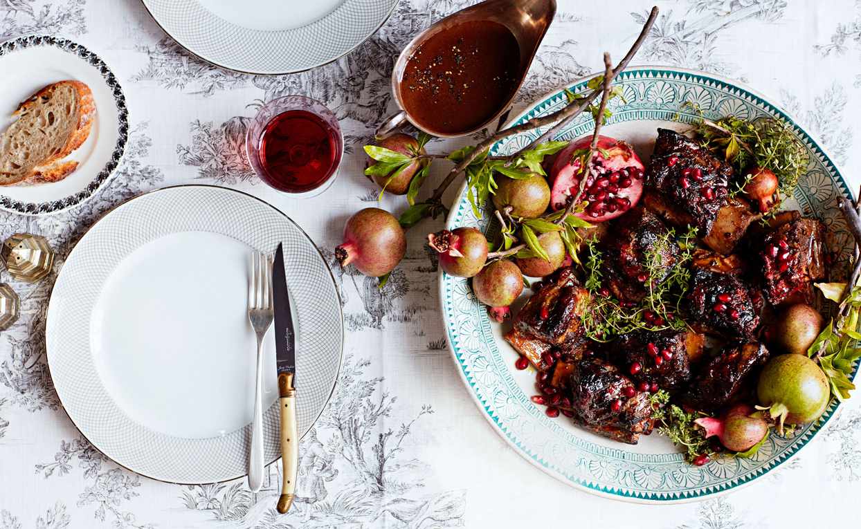 miso-tomato braised short ribs plated with pomegranate