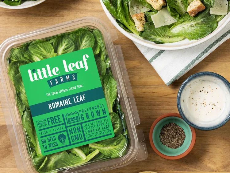 Package of Little Leaf Farms romaine leaves beside a salad and seasonings