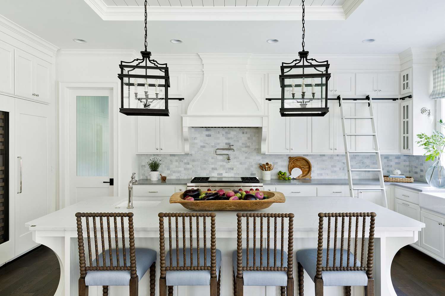 marble tiled backsplash in white and blue kitchen