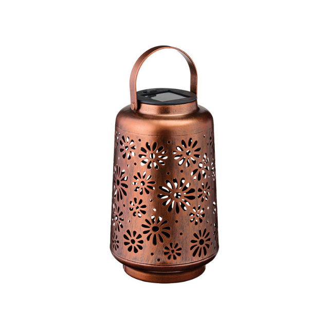 A decorative lantern with a floral cutout pattern and a handle