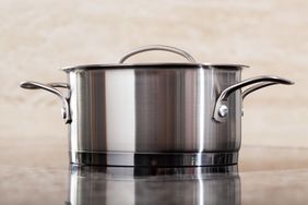 large metal pot with lid on surface