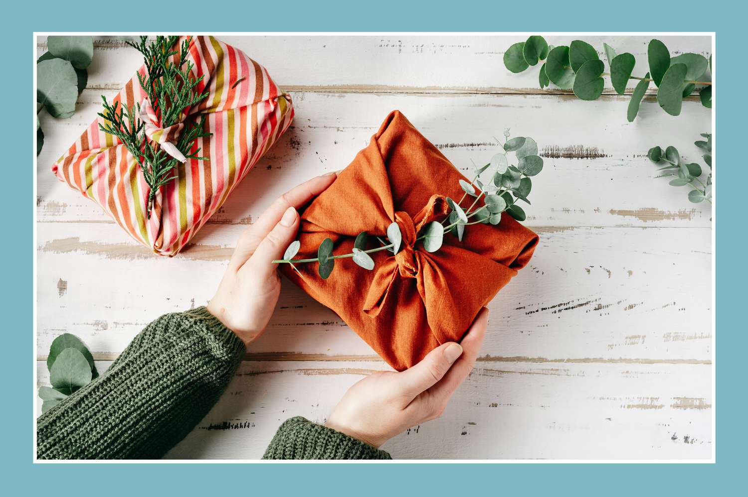 eco friendly furoshiki gifts on white wood