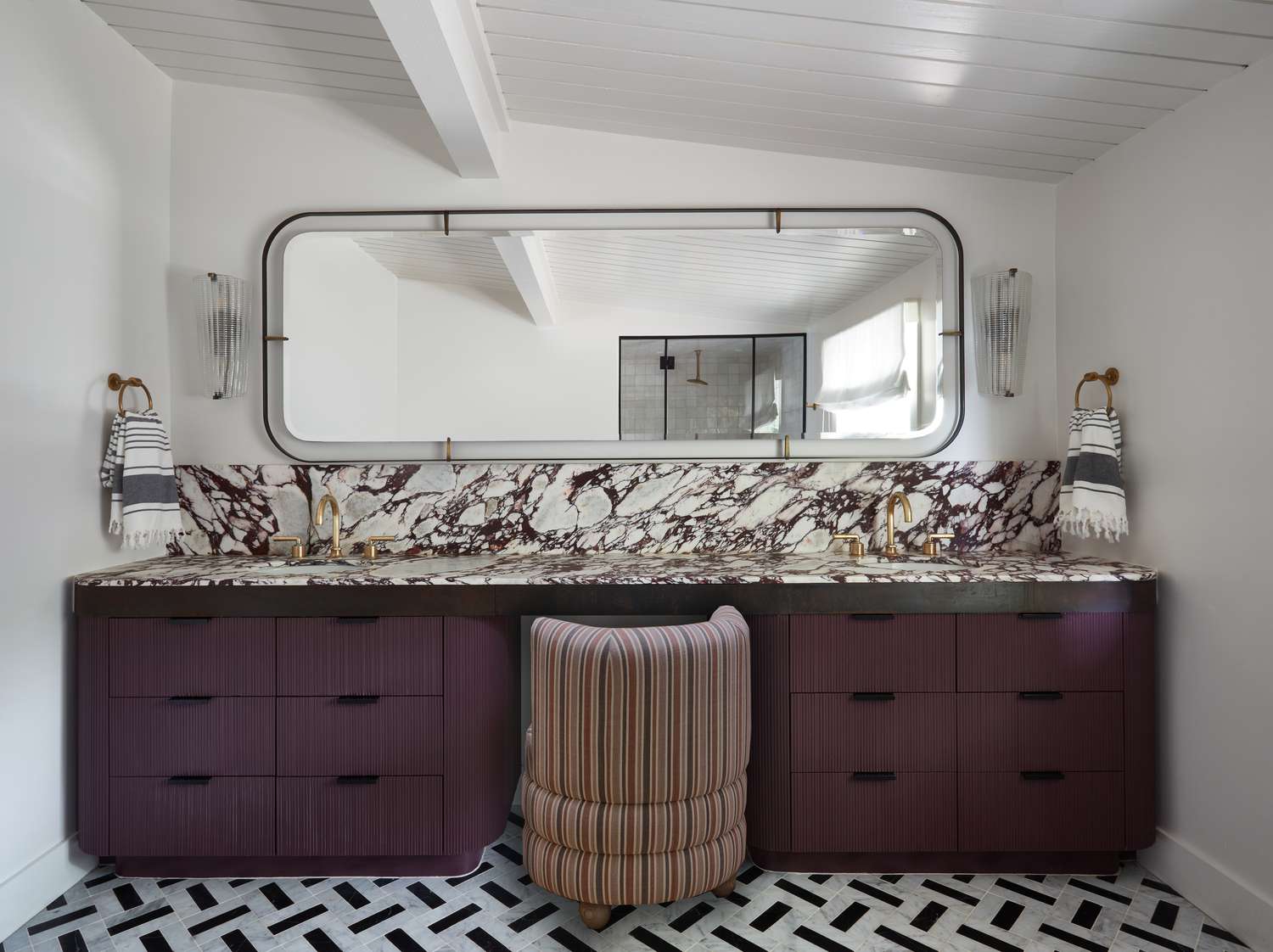 a bathroom with purple cabinets