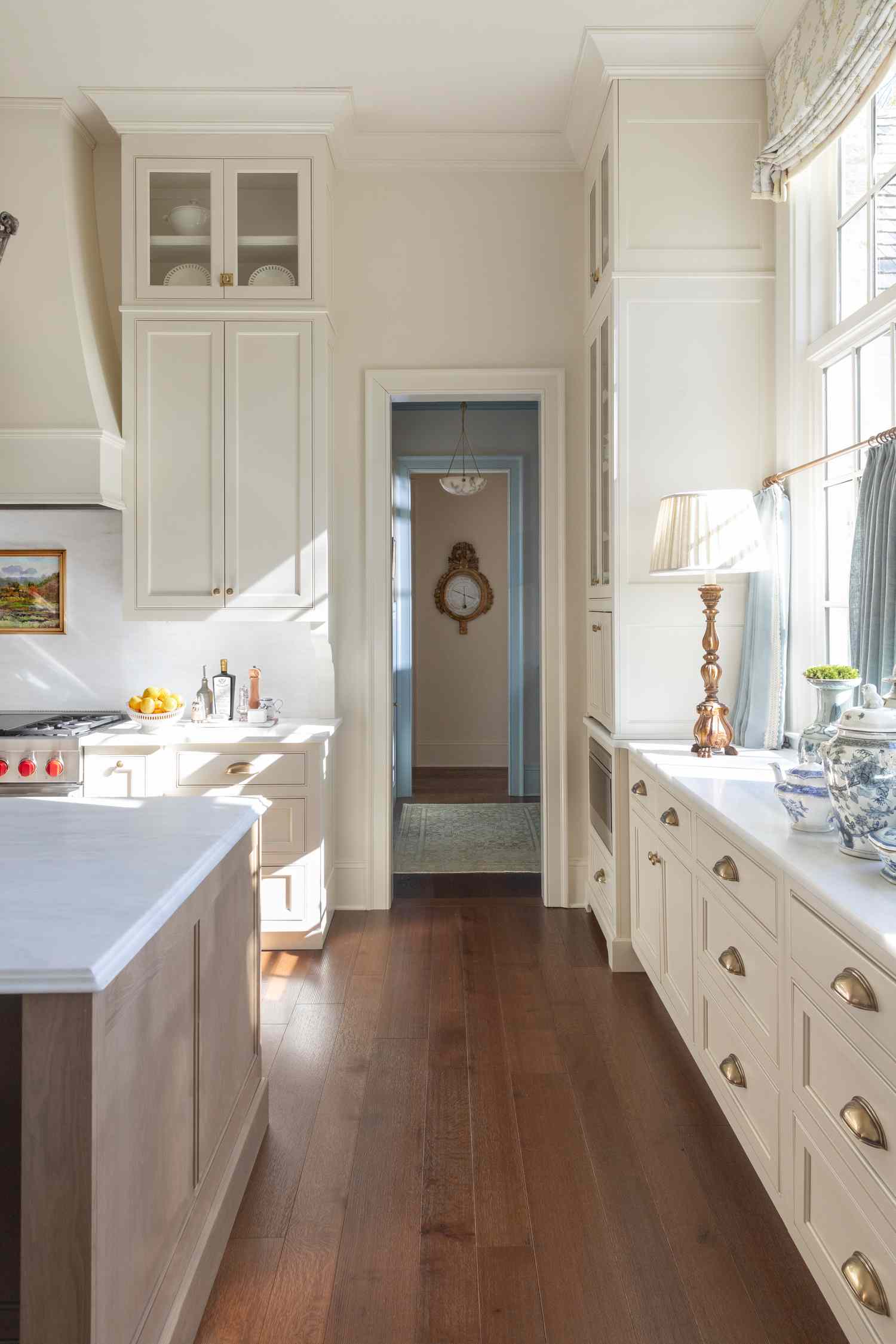 White and gold kitchen with crown molding