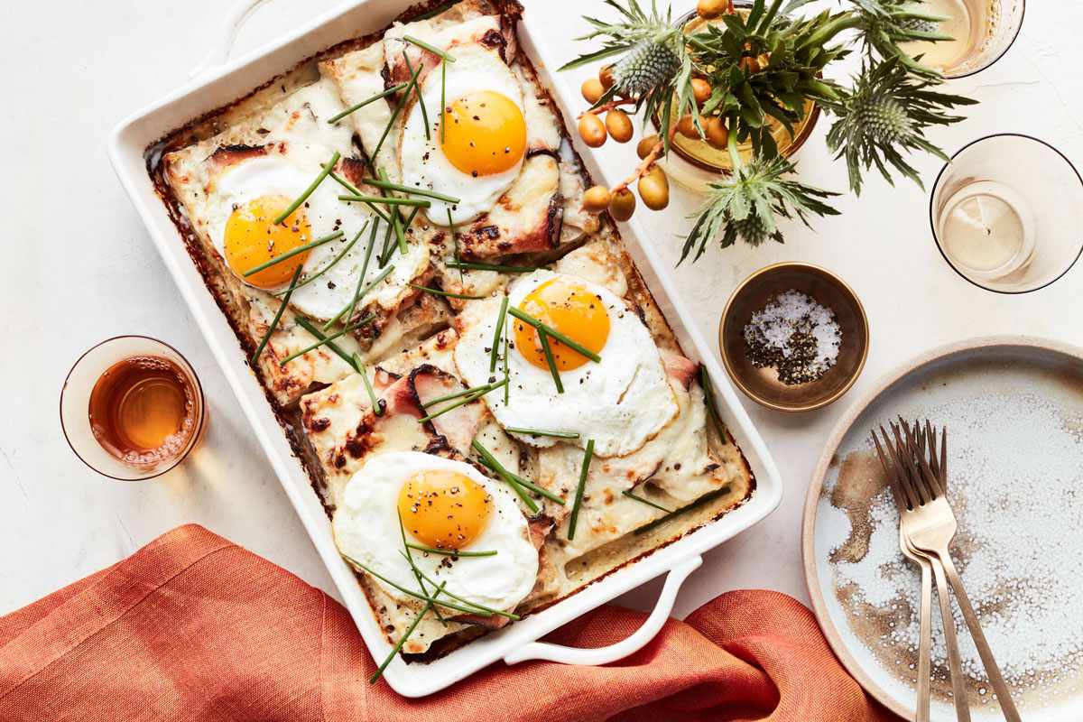 turkey-pastrami croque-madame casserole served in white dish