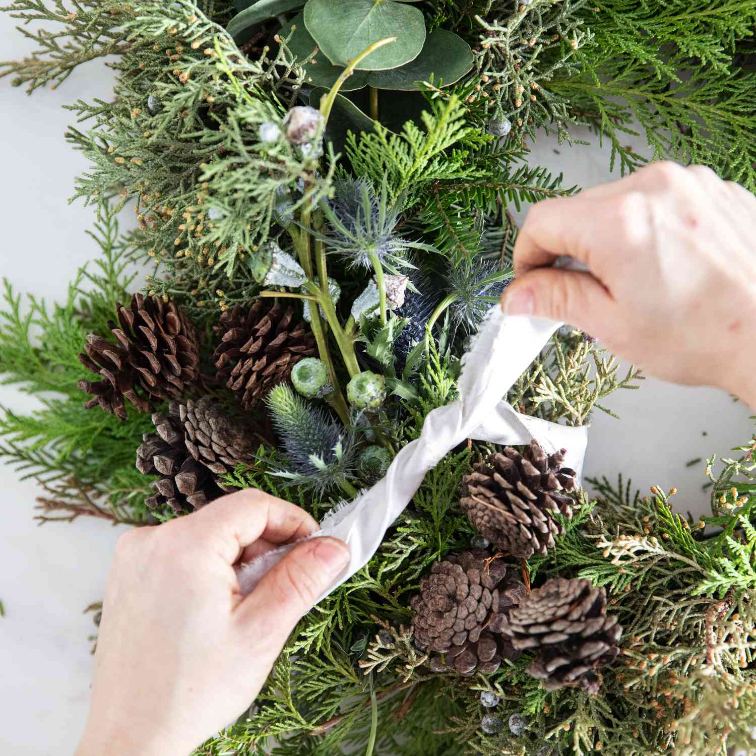 asymmetrical christmas wreath white ribbon