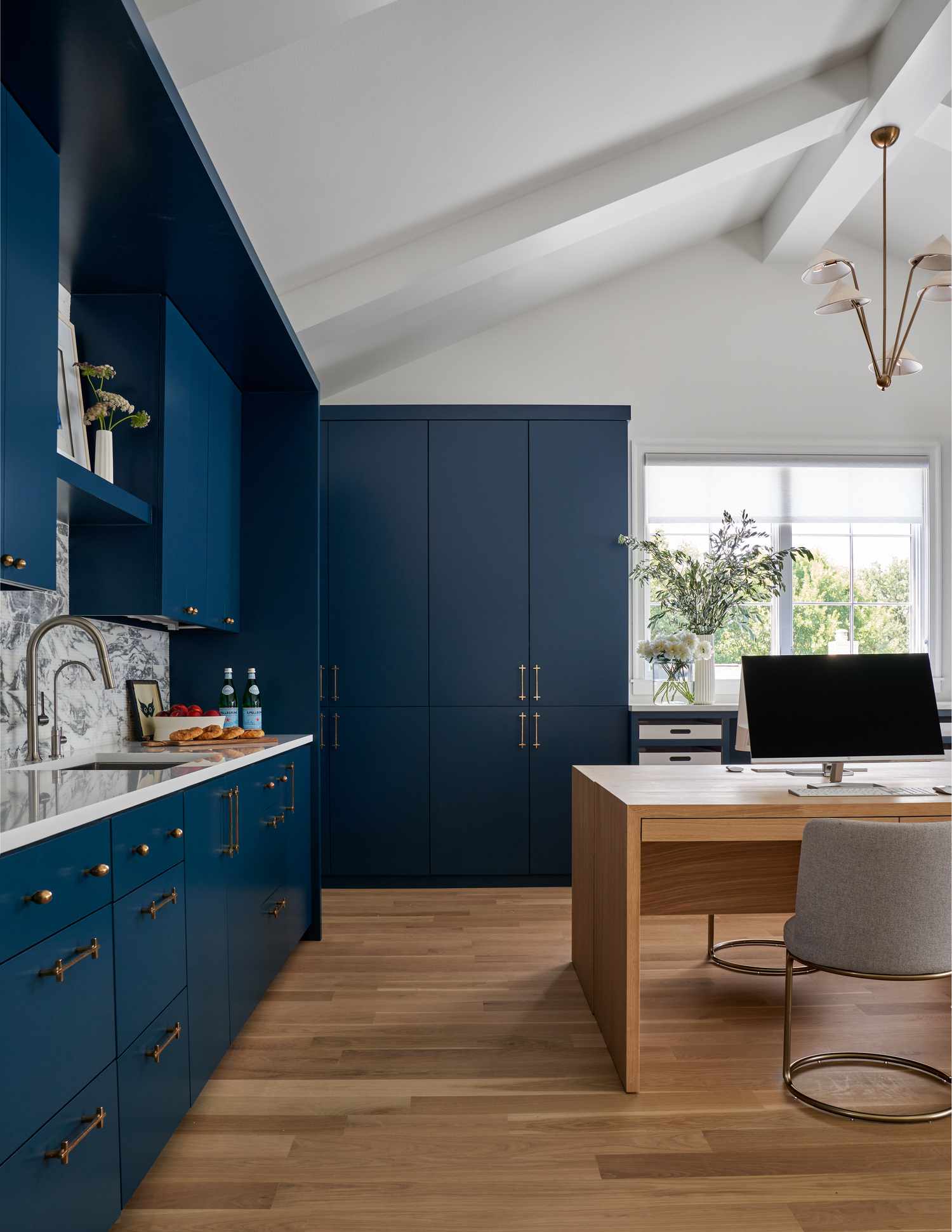 kitchen with blue cabinets and unique hardware