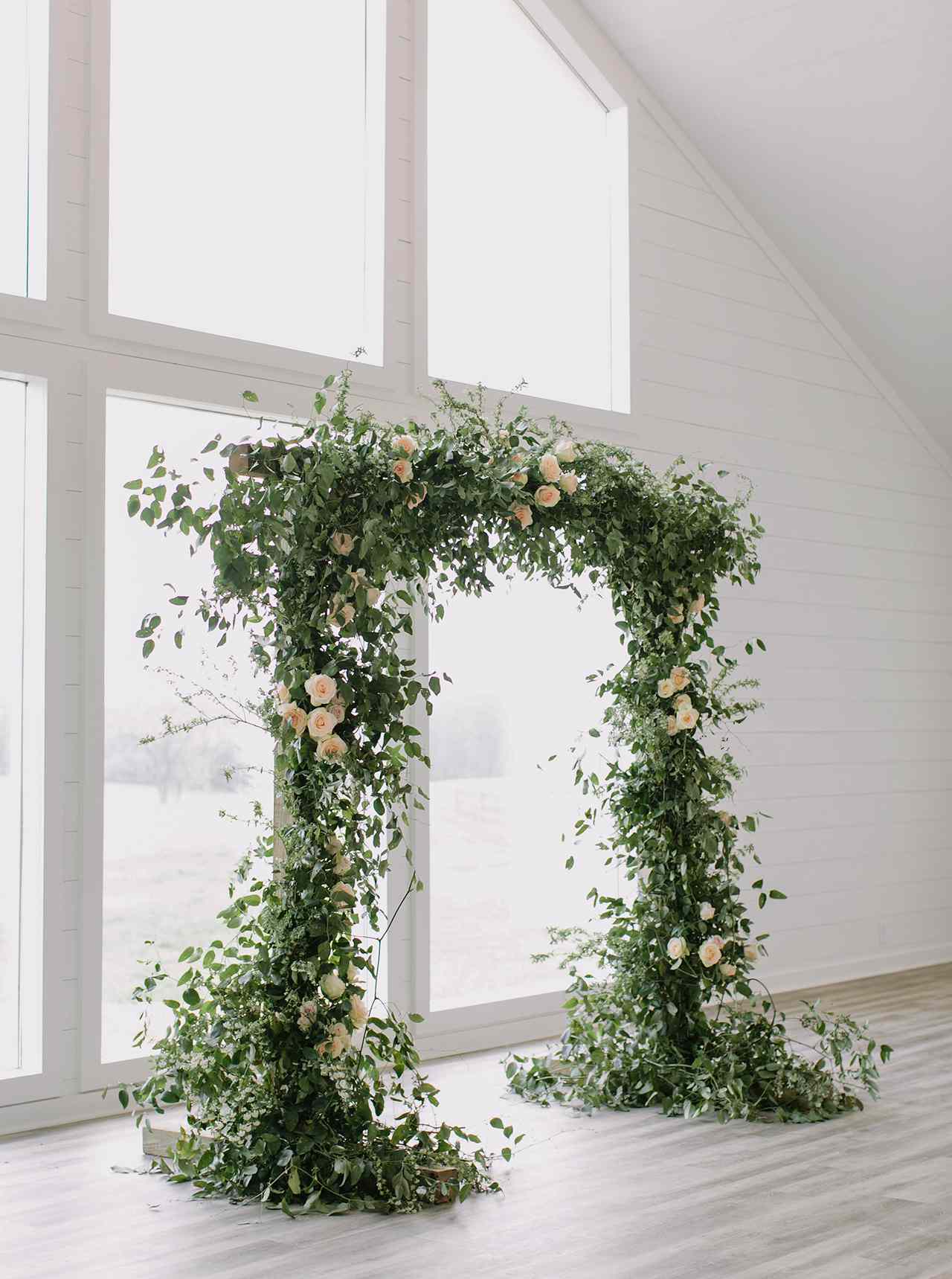 green white wedding ceremony arch window space