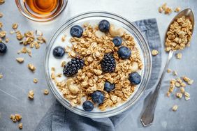 bowl of granola with milk and berries