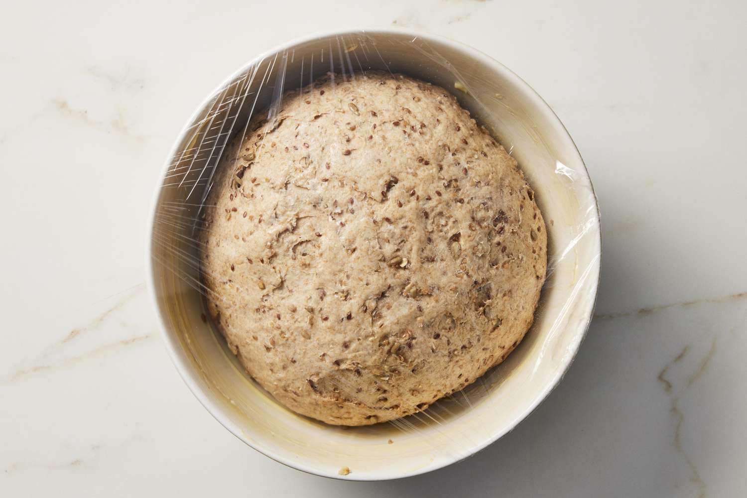 Risen dough in bowl 