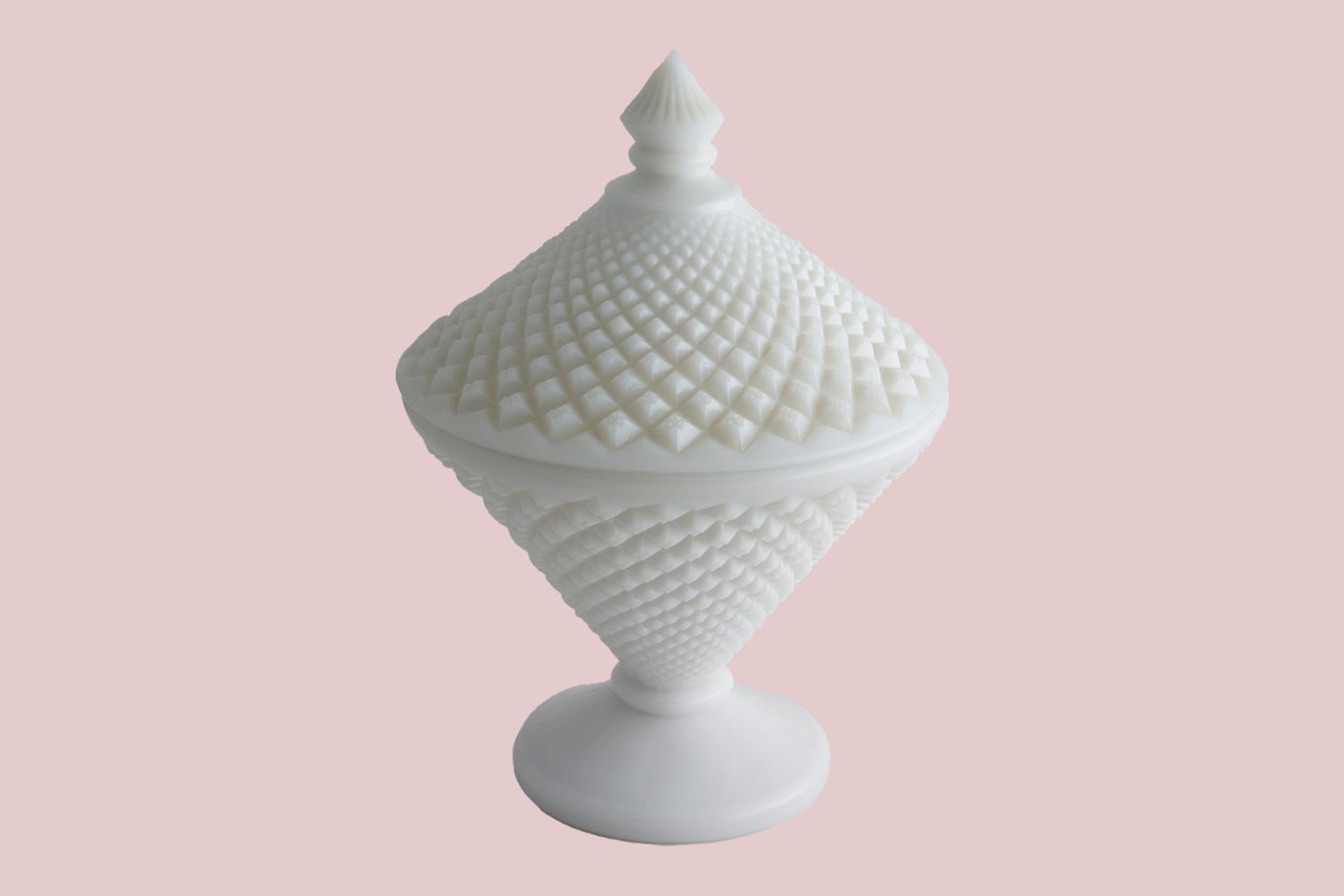 milk glass jar on pink background