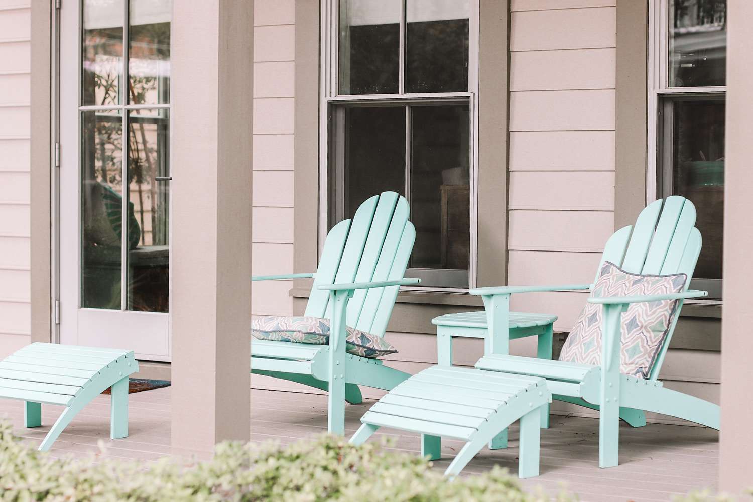 light pink front porch with mint chairs