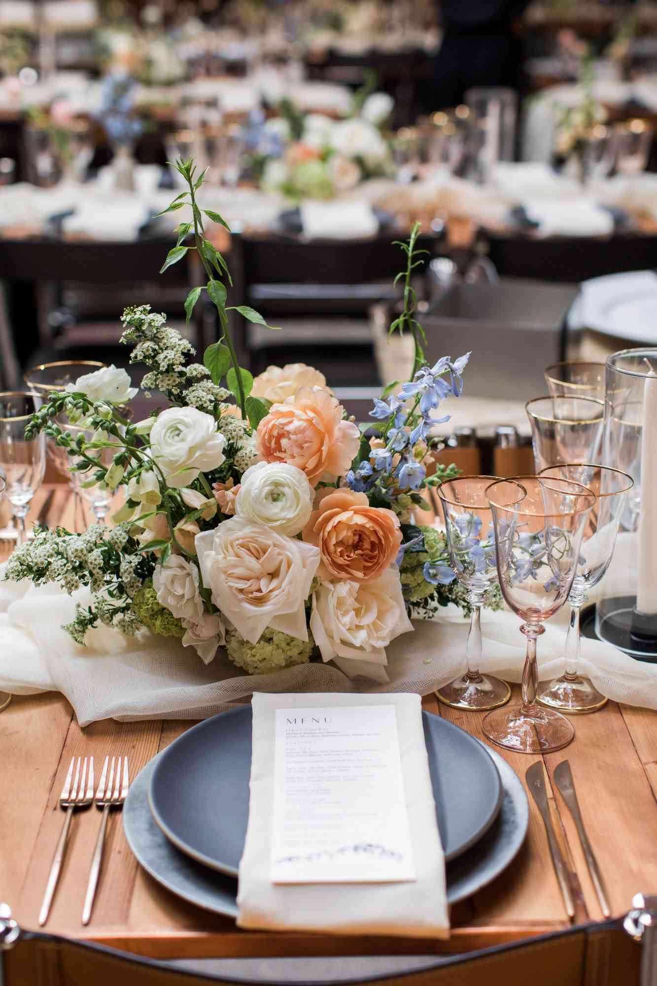 wedding place setting with men and floral arrangement