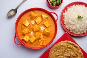 paneer butter masala with rice and parathas