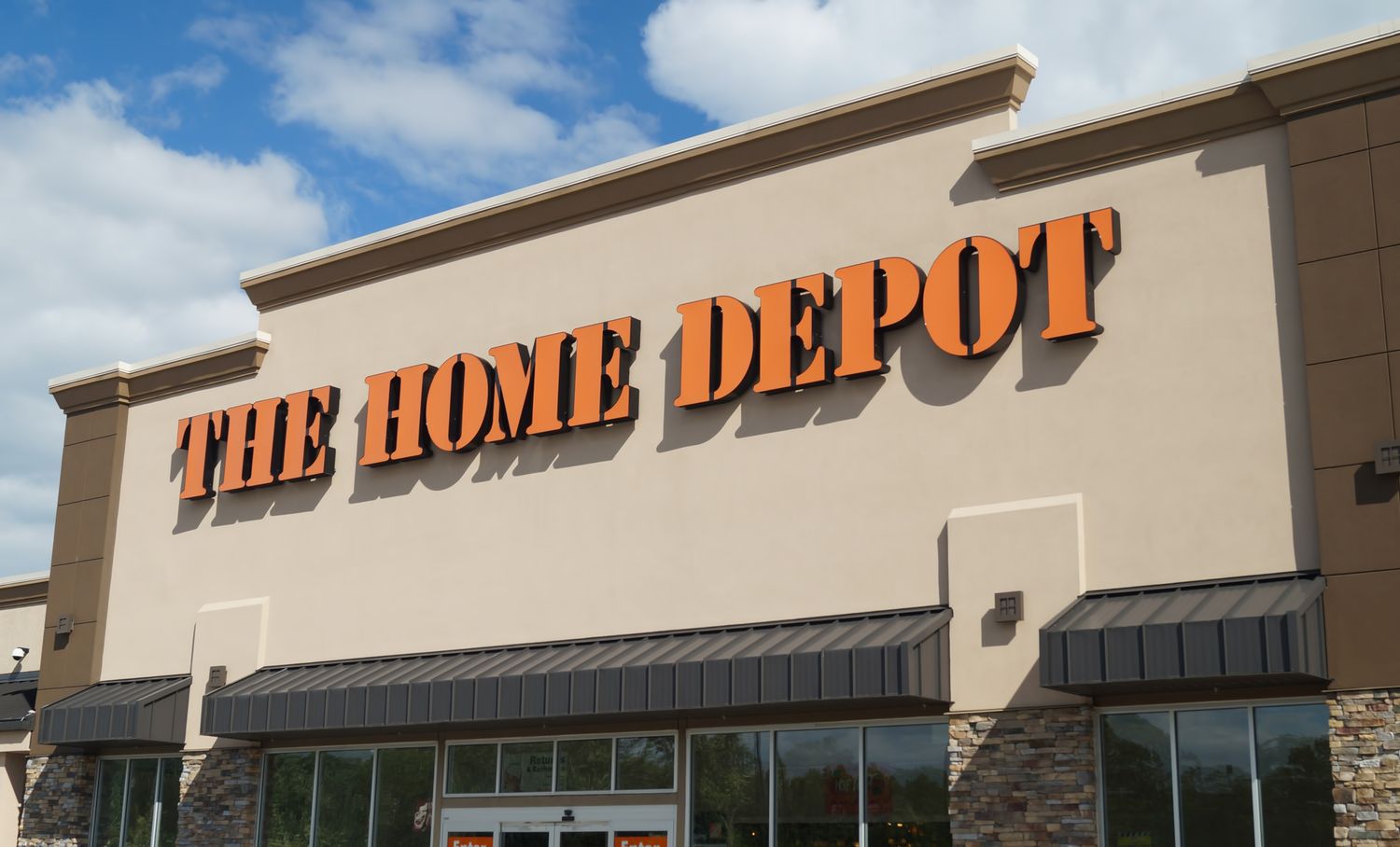 The exterior of a Home Depot store with its sign prominently displayed on the building