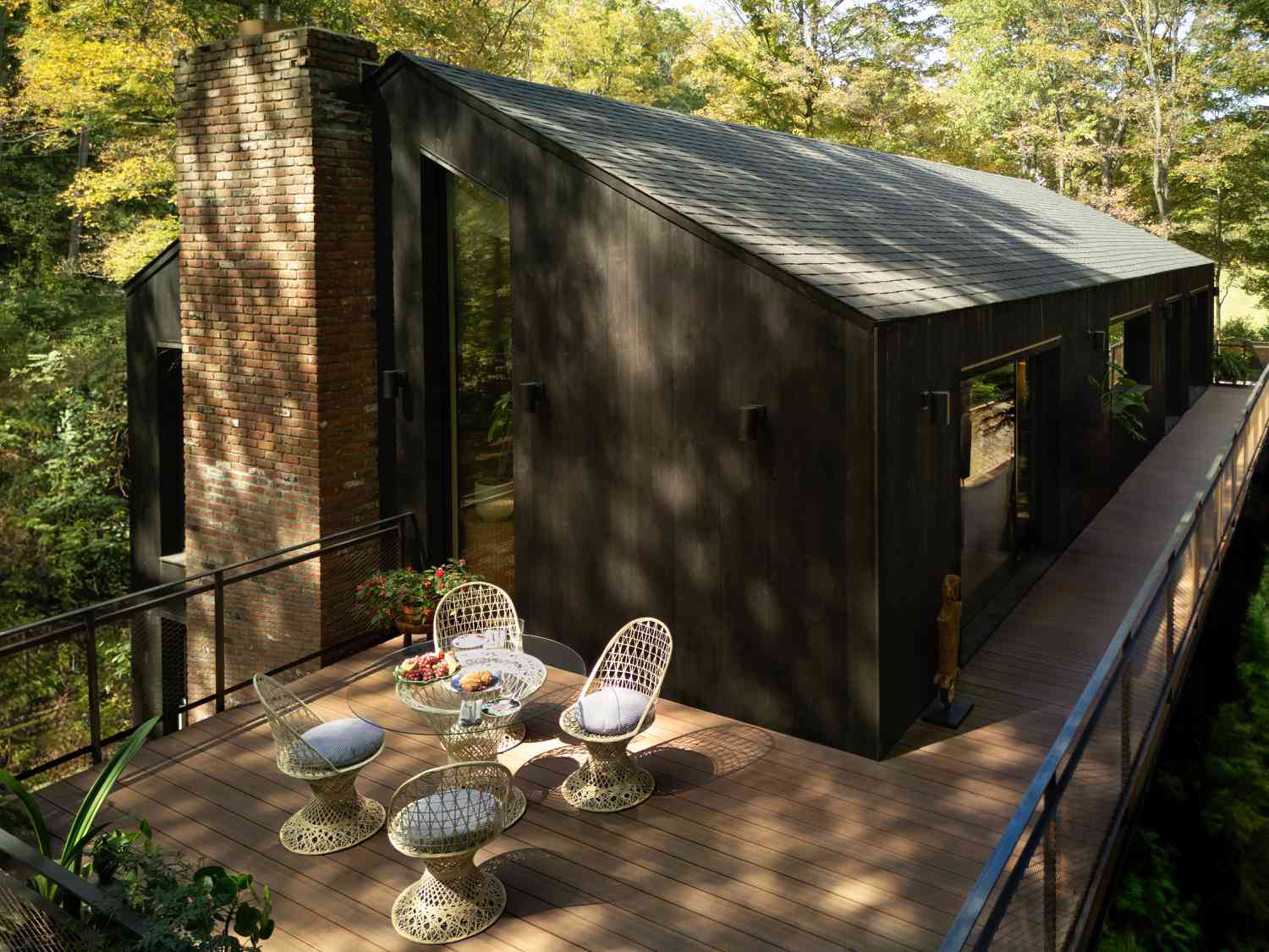 home in the woods with a deck 