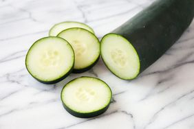 sliced cucumber on marble surface