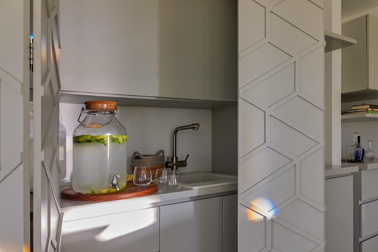 hidden cabinet tiny home kitchen idea